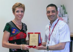 Mrs Nina Malej Primc accepts an award from dean Prof. Dr. Serdar Üşümez for Fotona's contribution to "Lasers in Dentistry Training Program"